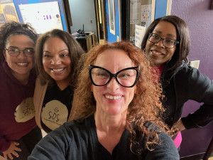 Serving Girls with the Butterfly Program four women smiling