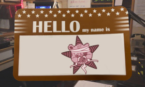 One of those labels which says "Hello My Name Is" but instead of a name, it's the Self Help Radio logo.